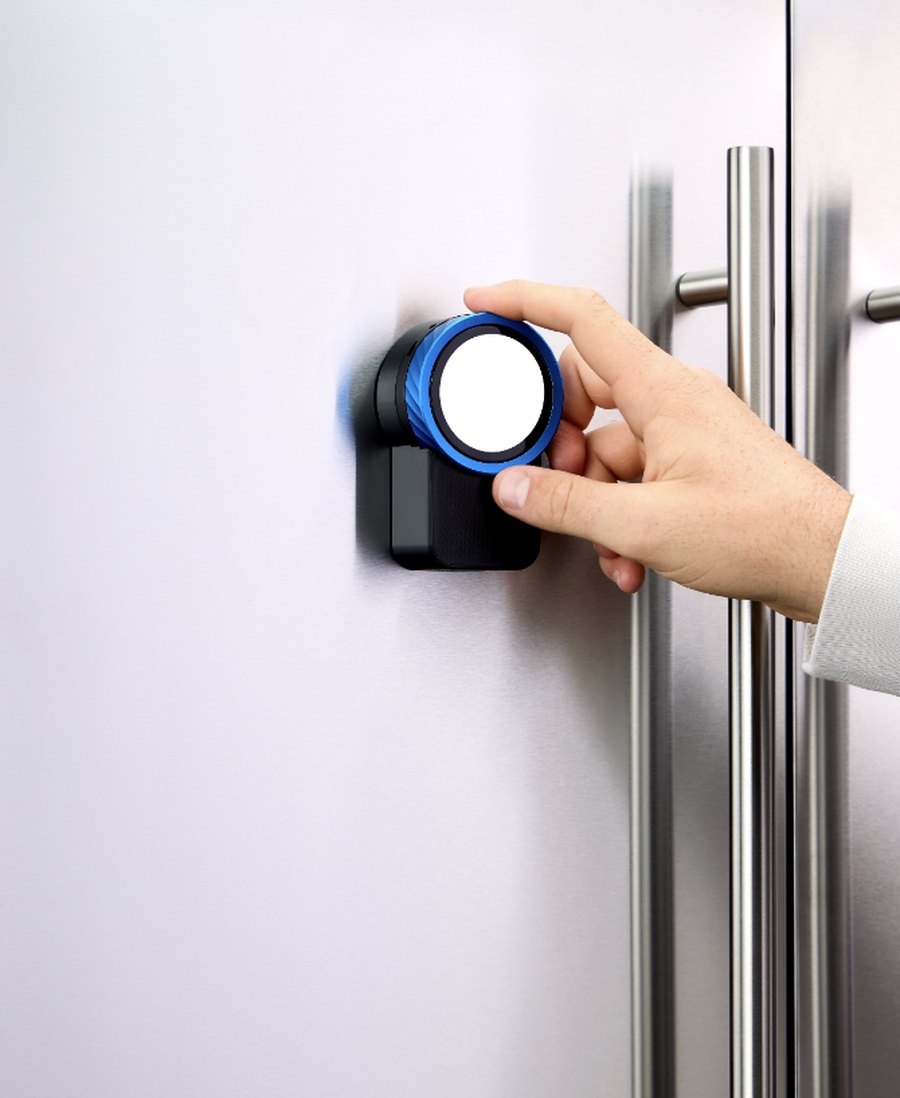 The Trepo device mounted on a fridge door